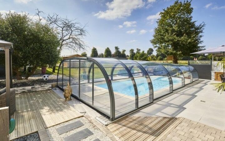 Abri de piscine modèle ELLIPTIK mi-haut télescopique. Structure aluminium de gris anthracite. Pour piscine 10x4 mètres. Abri de piscine modèle ELLIPTIK mi-haut télescopique. Structure aluminium de gris anthracite. Pour piscine 10x4 mètres.