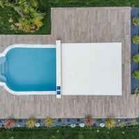 Couvrir une piscine hors-norme : les couvertures personnalisées sur-mesure