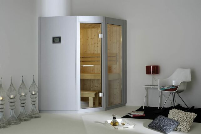 Une cabine de sauna deux places en angle sera facile à intégrer dans votre intérieur.